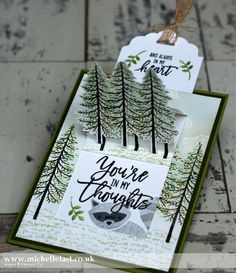 some cards with trees and words on them