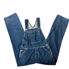 Features: * Decade: 1970 - 80's * Style: Workwear * Overalls * Solid * Made in Unknown * Machine Wash Size: Mens 34 Measurements: Waist: 34 in / 86 cm Inseam 32 in / 81 cm Condition: Pre-Owned Good Good condition, they do have some various faint spots, should come out in the wash. Retro Dark Wash Cotton Denim Jumpsuit, Retro Denim Blue Overalls With Pockets, Retro Medium Wash Cotton Overalls, Utility Washed Overalls For Workwear, Vintage Cotton Denim Jumpsuit With Button Closure, Retro Blue Denim Jumpsuit With Pockets, Retro Medium Wash Cotton Denim Jumpsuit, Vintage Dark Wash Cotton Denim Jumpsuit, Vintage Denim Blue Jeans With Pockets