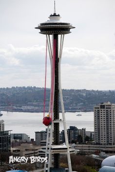 an aerial view of the space needle in seattle, with water and buildings in the background