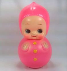 a pink toy sitting on top of a white table