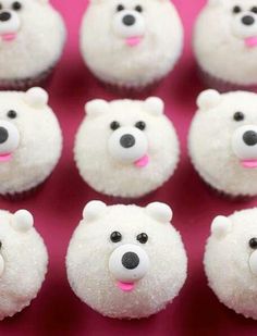 there are many small white teddy bears with pink noses on the top and bottom of them