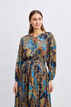 Chic & sophisticated, Elie’s favorite Paisley print gives our midi dress an artistic edge. Designed with a self-sash, blouson sleeves & an elastic waist, this paisley print midi dress exudes a sense of free-spirited elegance. T-Tahari Paisley Printed Long Sleeve Midi Dress 100% Polyester Georgette Runs true to Size Model is 5'9" and wearing size S Dry Clean Only Imported Style #: THF4D021 Tahari Dress, Dresses Royal, Print Midi Dress, Paisley Dress, Long Sleeve Short Dress, Sleeve Midi Dress, Long Sleeve Midi, Free Spirited, Printed Midi Dress