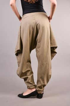 "Linen Harem Pants, Harem Trousers, Baggy Pants, Loose Pants. Extravagant harem trousers with interesting and unusual cut. The baggy pants are loose fit and feature drop crotch. The model is made of linen fabric so it is extremely comfortable women pants suitable for the daytime. If you are looking for the perfect addition to your casual outfit these loose pants are a great choice matched with flats or sneakers. ^ Sizes: The item can be made in sizes from XXS to 7XL. Please, use the size chart b Khaki Wide-leg Harem Pants Loosely Fitted Hips, Khaki Harem Pants With Loosely Fitted Hips, Baggy Khaki Trousers, Khaki Wide Leg Harem Pants With Loose Fit, Beige Baggy Wide-leg Harem Pants, Baggy Harem Pants With Hip Pockets And Tapered Leg, Baggy Harem Pants With Tapered Leg And Hip Pockets, Beige Wide-leg Harem Pants, Baggy Tapered Leg Beige Pants