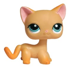 a small toy cat with big blue eyes on a white background and an orange tail