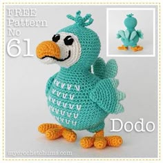 a crocheted blue bird with white lettering on it's face and feet