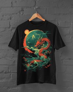 Embrace the spirit of the sea with the Water Dragon T-Shirt! This vibrant Japanese streetwear piece features a fierce water dragon surrounded by traditional kanji characters and the classic Kaganawa wave. Perfect for anime enthusiasts and lovers of Japanese culture, this Harajuku-style T-shirt captures the essence of mythical creatures and ancient art. Add a bold and dynamic touch to your wardrobe with this standout tee. FIT DESCRIPTION ------------------------ * Provides a comfortable, unisex fit * Made from 100% cotton * Features a professional, high-quality print * If you prefer a baggier fit, consider sizing up one size from your usual size. SIZE GUIDES ----------------- * Size Chart are in CM and Inches - Ensuring a perfect fit for everyone. AFTERCARE ---------------- * Machine wash: Dragon Tshirt, Kanji Characters, Design Dragon, Water Dragon, Japanese Dragon, Anime Tshirt, Japanese Streetwear, Harajuku Fashion, Japanese Culture