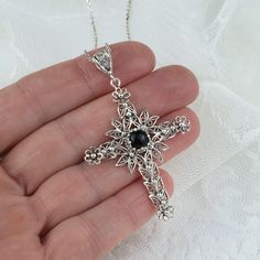 925 Sterling Silver Filigree Art Black Onyx Gemstone Cross Pendant Necklace Silver Chain length is 18.00" + 2.00" extender. Pendant height: 2.30" Pendant width: 1.50" Black Onyx Gemstone is 6 mm, cabochon round cut. Filigree is made of delicate metal strands that have been skillfully fashioned to create an outstanding combination of old and modern art. Originating in Mesopotamia, Anatolia. It is made of delicate metal strands that have been skillfully fashioned to create an outstanding combinati Black Gemstone Necklace For Wedding, Bohemian Silver Cross Pendant Jewelry, Crucifix Necklace With Intricate Design For Gifts, Intricate Crucifix Necklace As A Gift, Intricate Crucifix Necklace For Gift, Engraved Spiritual Black Jewelry, Engraved Black Spiritual Jewelry, Elegant Black Necklaces With Oxidized Finish, Elegant Black Necklace With Oxidized Finish