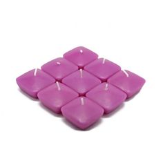 small pink candles are arranged in the shape of an eight - pointed square, on a white background