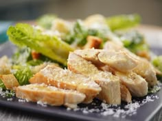 a close up of a plate of food with broccoli and chicken on it