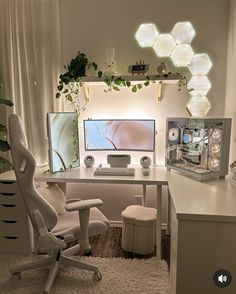 a white desk with a computer on it and a chair in front of the monitor