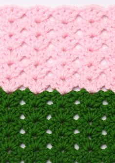 the crochet is pink, green and white with two rows of stitches on each side