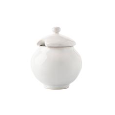 a white ceramic jar with a lid