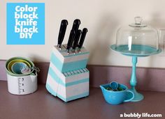 a kitchen counter topped with blue and white utensils