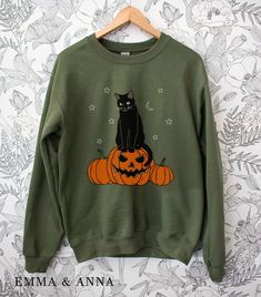 Black Cat on Pumpkin Halloween Sweatshirt * Product Details - Printed with ink - Unisex Sweatshirt - Designed with pre-shrunk soft air-jet spun yarn - Features a crewneck - Double-needle stitched collar, shoulders, armholes, cuffs and hem - Loose fit for a comfortable feel * Sizing and Colors - Please refer to sizing and color charts in the images * Fabrication - 50% cotton, 50% polyester * Care Instructions - Turn inside out and machine wash cold on delicate cycle - Dry on low heat setting - Do Cat On Pumpkin, Cat Pumpkins, Ghost Gifts, Pumpkin Sweatshirt, Pumpkin Sweatshirts, Pumpkin Ghost, Scary Pumpkin