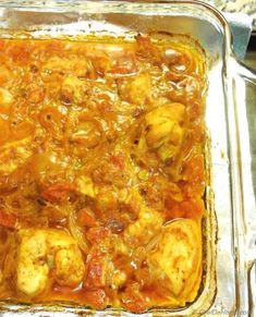 a casserole dish filled with meat and vegetables