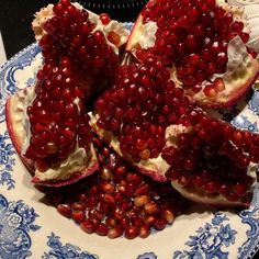 the pomegranates are cut in half on the plate