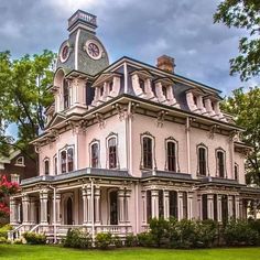 an old victorian style house with a clock tower