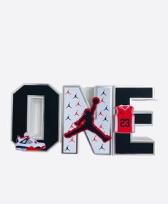 the word air jordan spelled out in 3d letters with a basketball jersey and sneakers on top