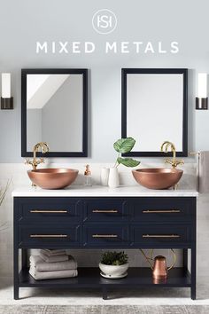 a bathroom with two sinks, mirrors and towels on the counter top that says mixed metals