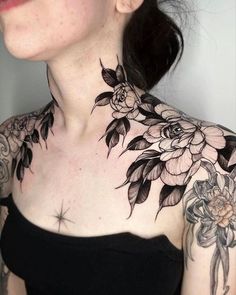 a woman with tattoos on her neck and chest