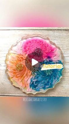 a glass plate with flowers painted on it and the words melon written in large letters