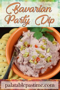 a bowl filled with food next to crackers on top of a wooden table and the words hawaiian party dip above it