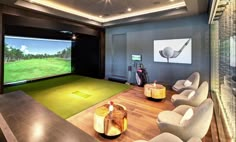 a golf simulator is set up in the middle of a room