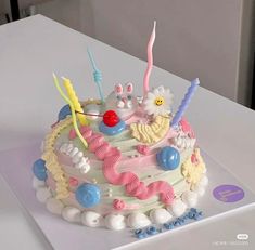 a birthday cake with candles and decorations on it