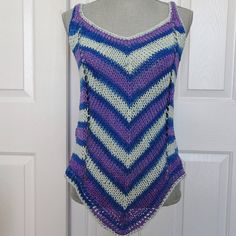 "Soft cotton yarn makes up this delightful and playful striped summer tank top.  Perfect weight for the season with a flattering diagonal stripe pattern on both front and back. The color and pattern is royal blue,light blue and purple striping which follows the dictate of the colors in the yarn.  It will fit a woman's size  medium.  Top can be worn over a bathing suit, camisole or halter top layered. or by itself.   Measurements: ( taken lying flat)                               Bust, 36\"- 38\"                               Hip Area  36\"-40\"                               Under Arm Side  12 1/2\", over all length from shoulder to peak on hem is 28\". There is comfortable stretch in excess of those measurements giving the top a wonderful drape. All of my tank tops and camisoles are hand k Summer Knit Top, Knitting Summer, Summer Top Pattern, Diagonal Stripes Pattern, Summer Knit Tops, Summer Tank Top, Knit Tank Top, Yarn Sizes, Womens Tank Tops