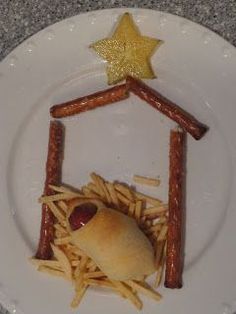 a white plate topped with fries and a hot dog in a house shaped like a star