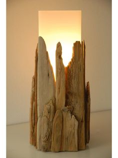 a light that is sitting on top of a wooden block with some wood pieces in front of it