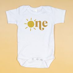 Printify Graphic Tee Sun in One 1st Birthday Bodysuit First Birthday Spring Cotton Bodysuit, Spring Cotton Bodysuit For First Birthday, Cute Summer Onesie For Birthday, Fitted Bodysuit For First Birthday In Summer, Fitted Summer Onesie For Birthday, Fitted Onesie For Summer Birthday, Fun Summer Birthday Onesie, Yellow Summer Bodysuit For Playtime, Yellow Bodysuit For Summer Playtime