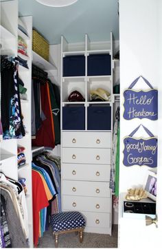 an organized closet with clothes, shoes and other items in it's storage area