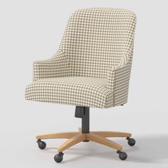 an office chair with wheels and checkered upholstered fabric