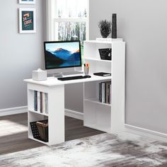 a white desk with a computer on top of it