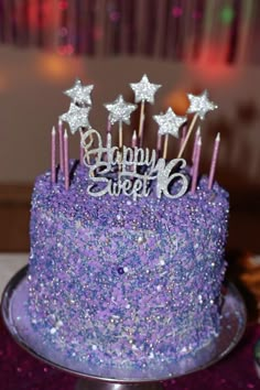 there is a purple cake with stars on it and the words happy sweet six spelled in white letters