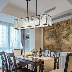 a dining room table with chairs and a large map on the wall