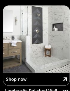 a bathroom with marble walls and flooring is featured in the ad for lombadia polished wall