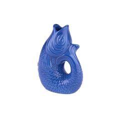 a blue vase shaped like a fish on a white background