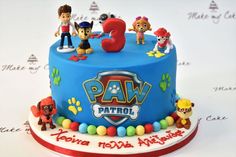 a birthday cake with paw patrol characters on it