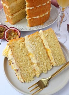 a slice of cake on a plate with a fork next to it and another piece has been cut from the cake