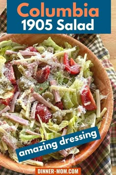 a salad in a wooden bowl on top of a checkered table cloth with the title columbia 1055 salad