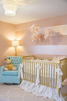 a baby's room decorated in pink, white and gold