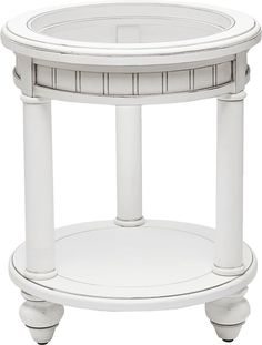 a white round table with columns on the bottom