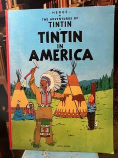 a book about the adventures of tintin in america with an image of a native american man