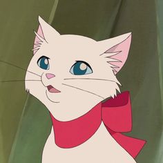 a white cat with blue eyes and a red bow around its neck