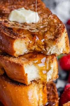 french toast is being drizzled with butter and syrup