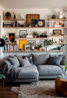 Grey Couch Living Room Gray Couch Family Room, Decorate Grey Couch, Apartment Decorating Grey Couch, Silver Couch Living Room, Grey Sectional Living Room, Shelves Over Couch, Floating Shelves Above Couch, Living Room Grey Couch, Grey Couch Living Room Ideas