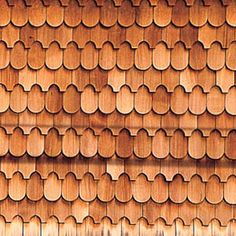 a close up view of a wooden wall with circles and lines on the wood grained surface