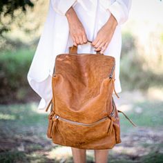 This stunning backpack is made of genuine soft nappa leather in a Honey Brown color. With enough room for all your daily essentials, It is perfect for everyday use, as well as for laptops of all sizes, IPAD, A4 files, books and travel. it as a unique structured with a zipper closure at the top, and three outside zipper pockets for mobile, keys, etc. It is fully lined with black strong cotton fabric which I divide to two large interior, zip pocket, and a leather cell phone pocket, shoulder strap Faux Leather Travel Satchel Backpack, Faux Leather Satchel Backpack For Travel, Large Capacity Faux Leather Backpack, Faux Leather Backpack For Daily Use, Faux Leather Satchel Backpack For Everyday Use, Brown Faux Leather Backpack For On-the-go, Leather Softback Backpack With Zipper Closure, Faux Leather Soft Backpack, Brown Faux Leather Standard Backpack